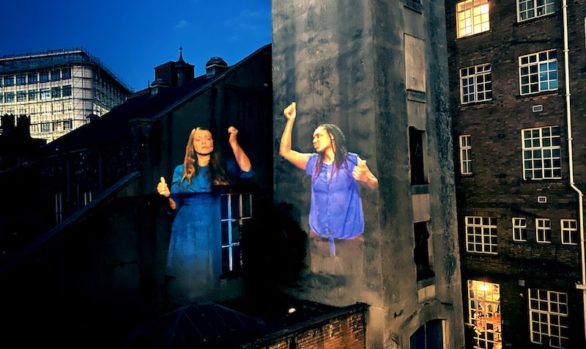 Projection of sign language onto buildings at Bridewell Island